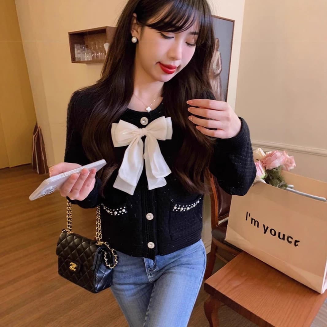 フレンチガーリー パール調ボタン付き大きめリボンニットカーディガン