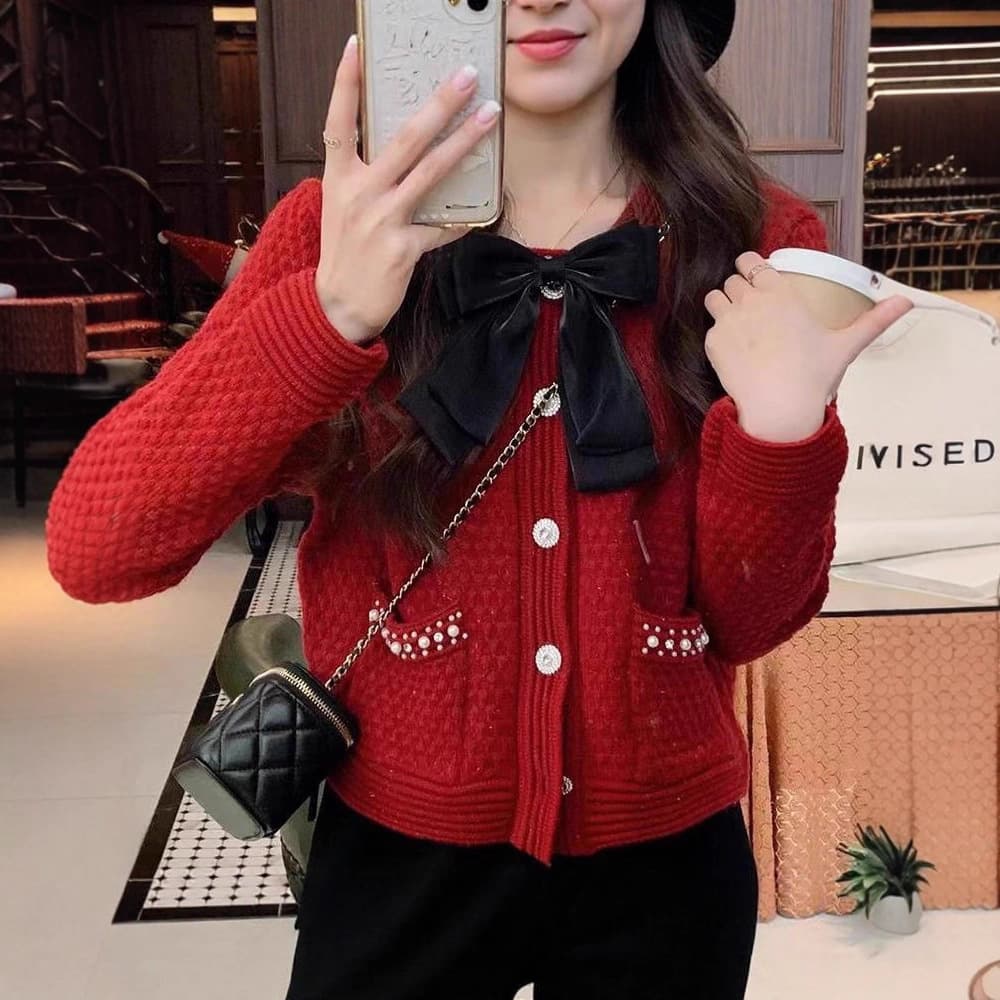 フレンチガーリー パール調ボタン付き大きめリボンニットカーディガン