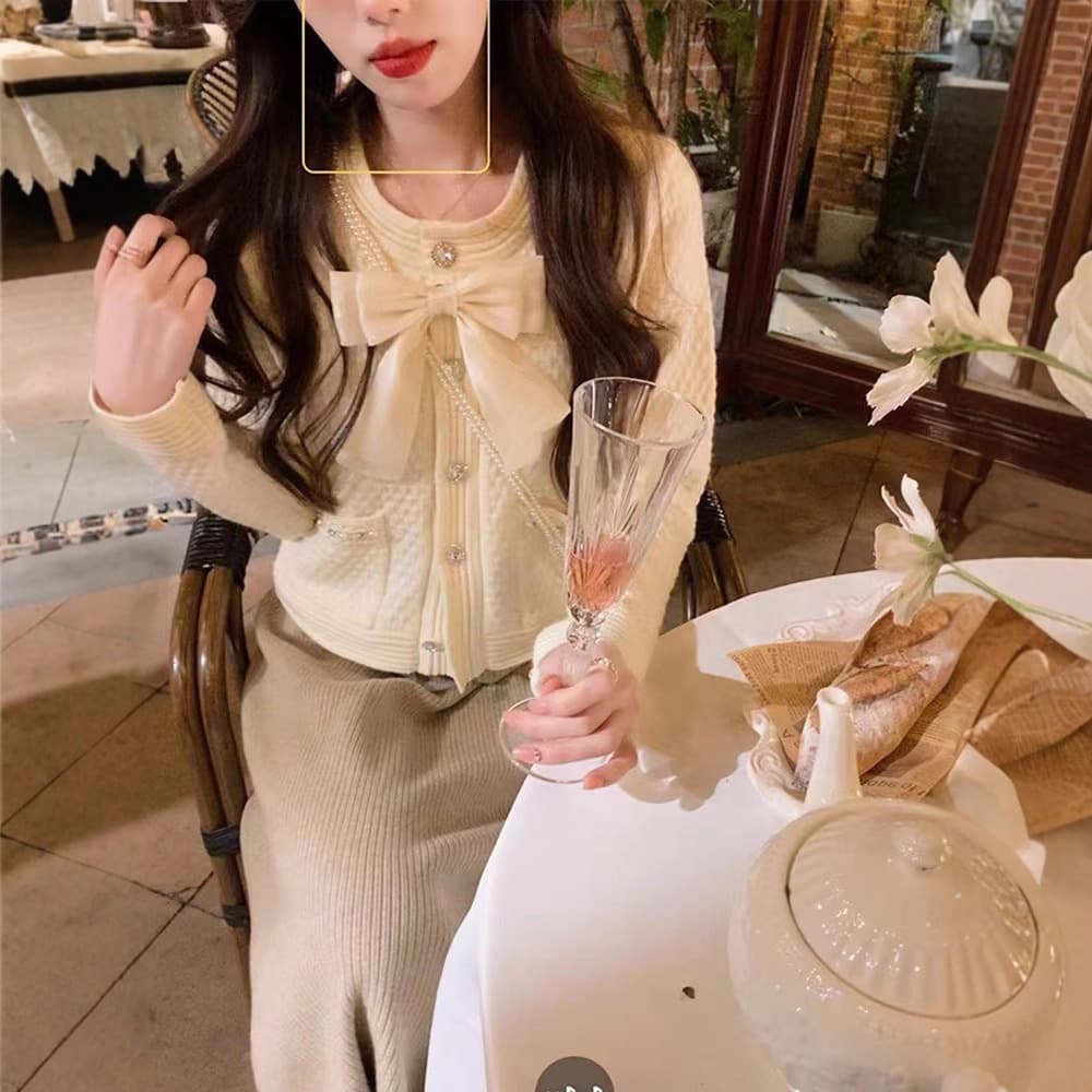 フレンチガーリー パール調ボタン付き大きめリボンニットカーディガン